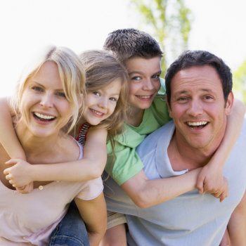 cheerful couple with two children