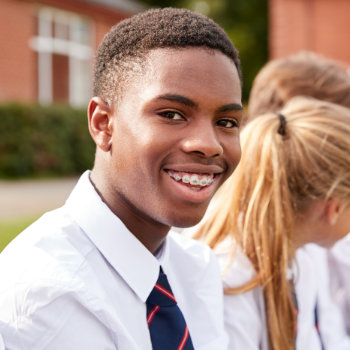 young african american student smiling with braces